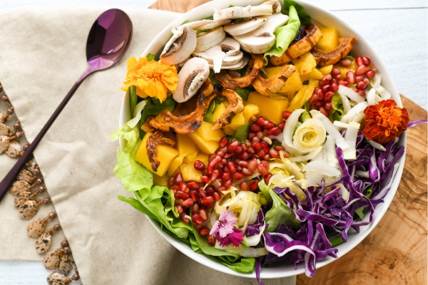 A vibrant salad bowl filled with colorful fresh vegetables served at Chiu’s café, showcasing a light and nutrient-rich meal ideal for runners in a tropical climate.