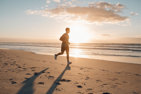 Athlete training outdoors in midday sun wearing extra layers
